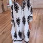 Verfijnde oversized shirtjurk met decolleté