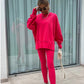 Een tweedelig set voor dames: effen sweatshirt met lange mouwen en een legging